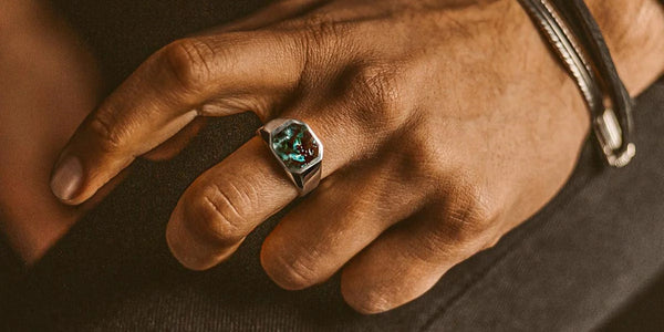 Signet Ring on the Middle Finger