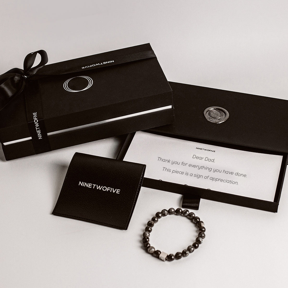 Father’s Day gift box with a beaded bracelet and a handwritten note