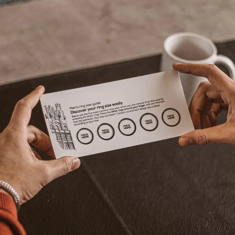 A person holding up a business card mockup.
