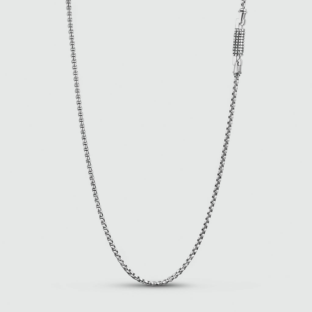 A handmade Kamal - Sterling Silver Box Chain Necklace 3mm with a clasp on a white background.