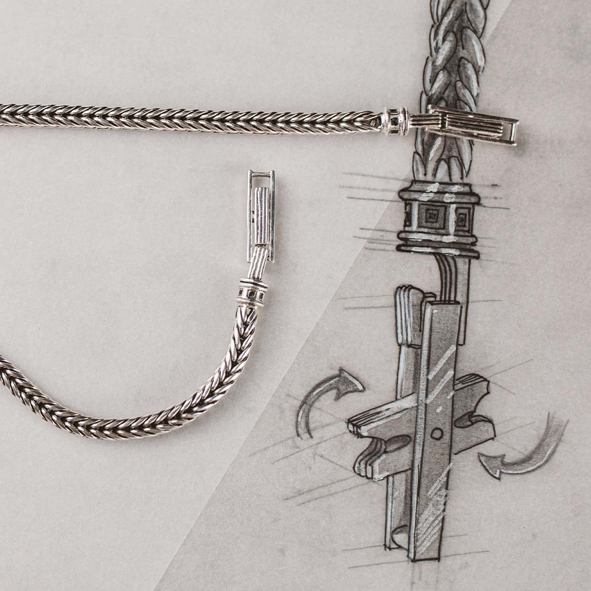 A drawing of a chain with a cross on it.