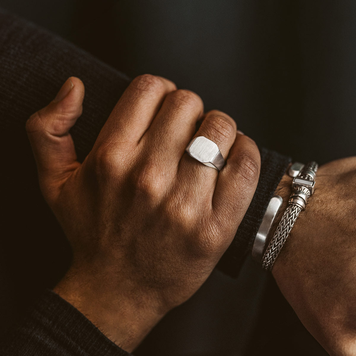 The front view of tameem signet ring and bracelets