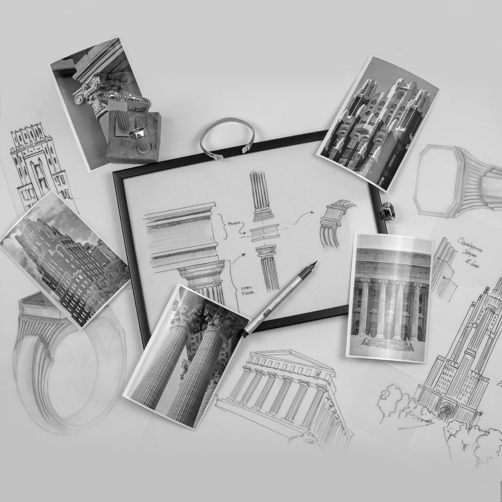 Une planchette à pince avec des dessins de bâtiments et un stylo.