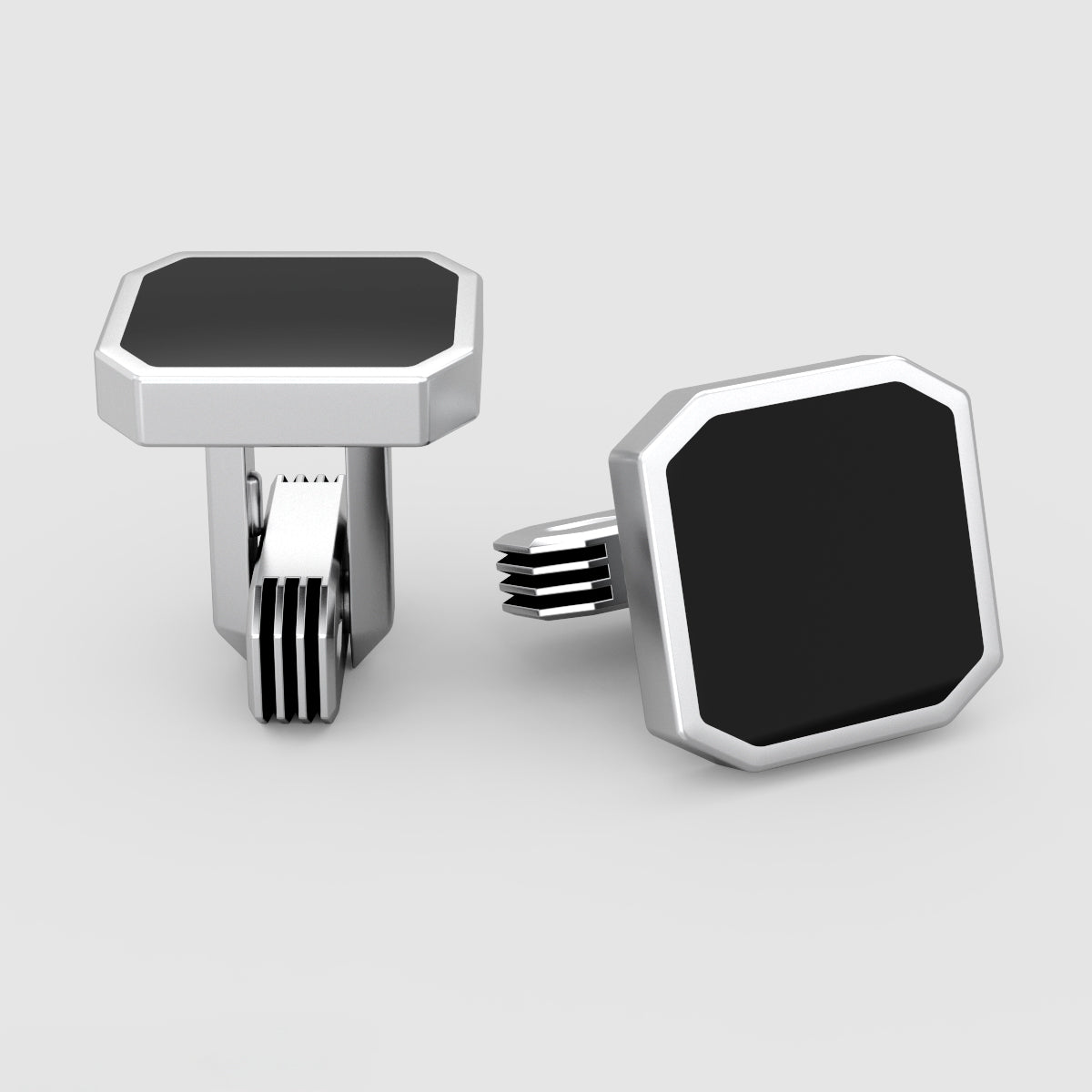 Gros plan sur les boutons de manchette pour homme en Onyx noir Nael avec fermoir et détails en argent de Ninetwofive.