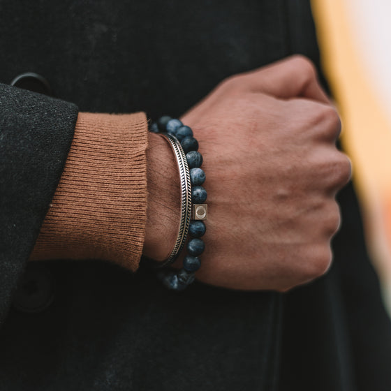 Azraq mens sodalite stone blue beaded bracelet and a silver cuff bangle, styled together by Ninetwofive.
