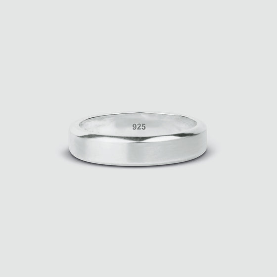 An engraved Tamir matt silver ring for men by Ninetwofive on a white background.
