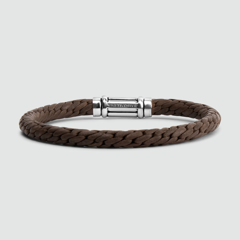 A Taissir brown braided bracelet with a silver clasp. This mens bracelet features a solid silver clasp.