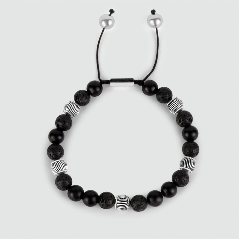 Top view of Kaliq mens adjustable black onyx beaded bracelet with sterling silver beads.