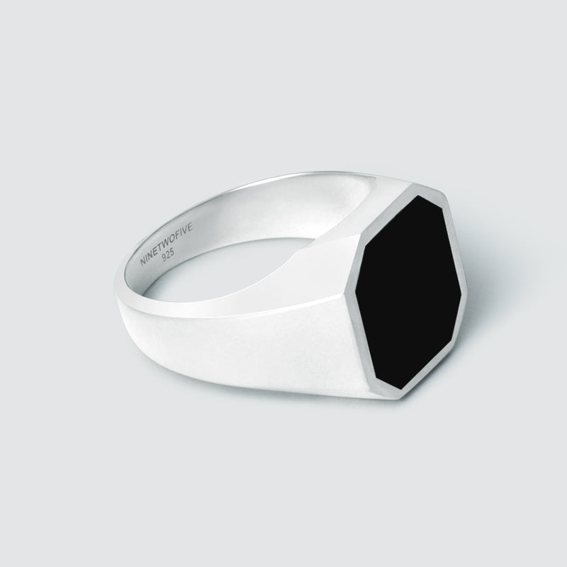 Side view of Naim black onyx mens signet ring, showing 925 and Ninetwofive logos engraved inside. 