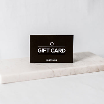 A luxury gift card box is sitting on top of a marble table.