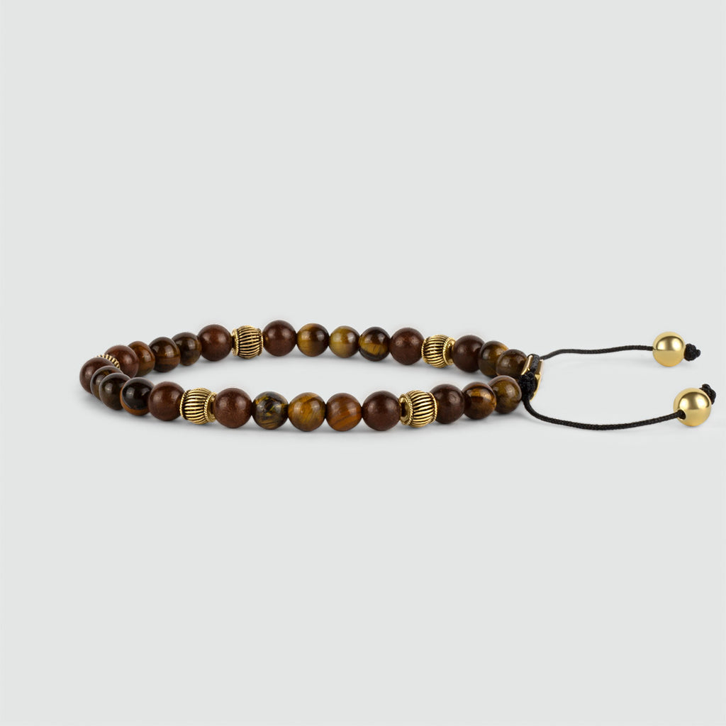 A Kaliq - Bracelet réglable en perles d'oeil de tigre en or 6mm avec des perles d'oeil de tigre et des perles en or.