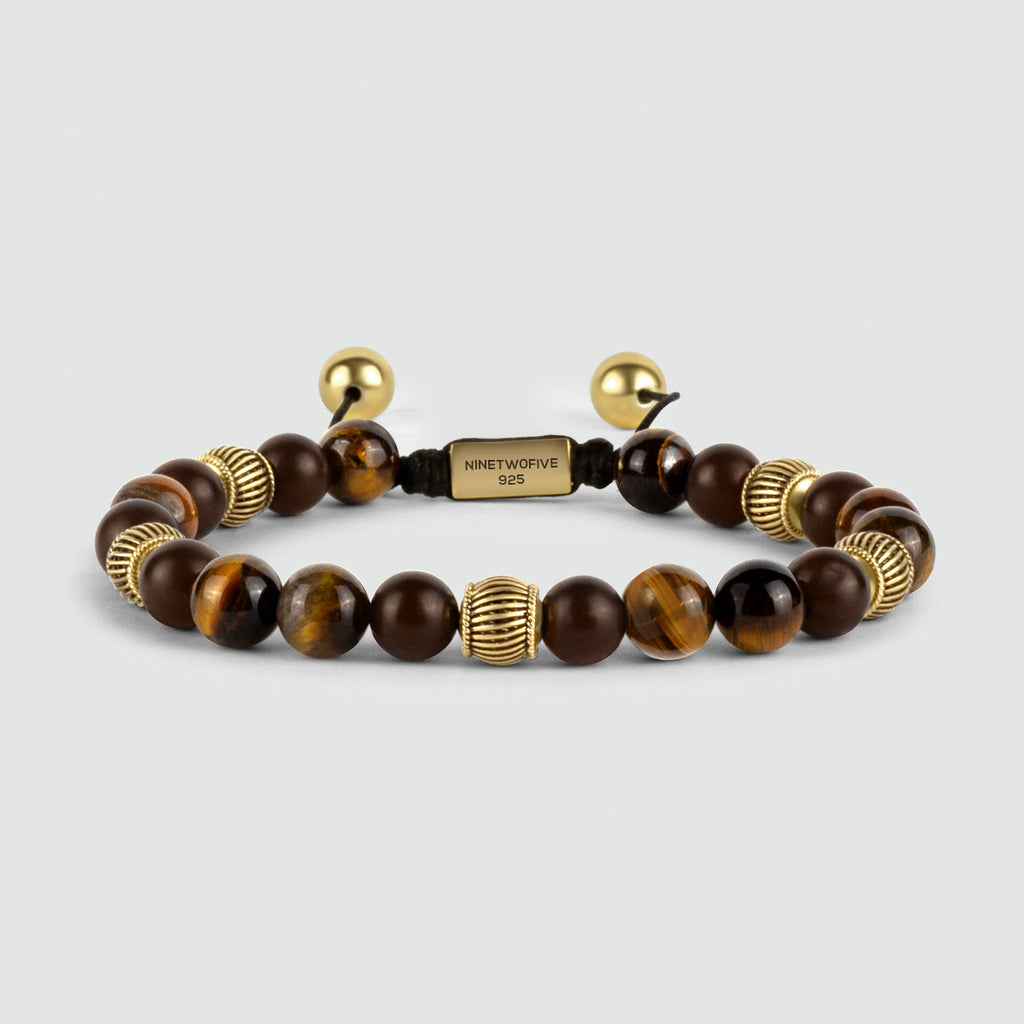 A Kaliq - Adjustable Tiger Eye Beaded Bracelet in Gold 8mm, crafted with 18k gold bonded sterling silver.