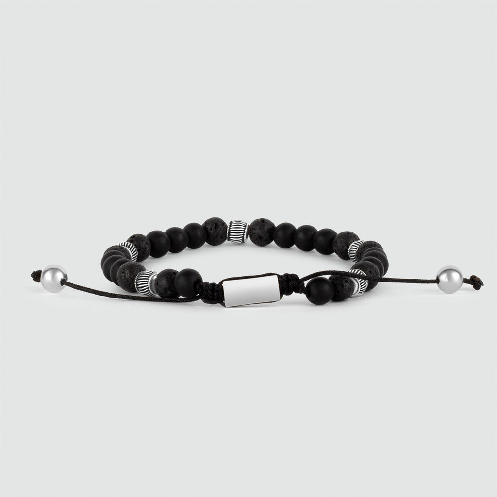 A Kaliq - Adjustable Onyx Black Beaded Bracelet in Silver 6mm with a silver bead.