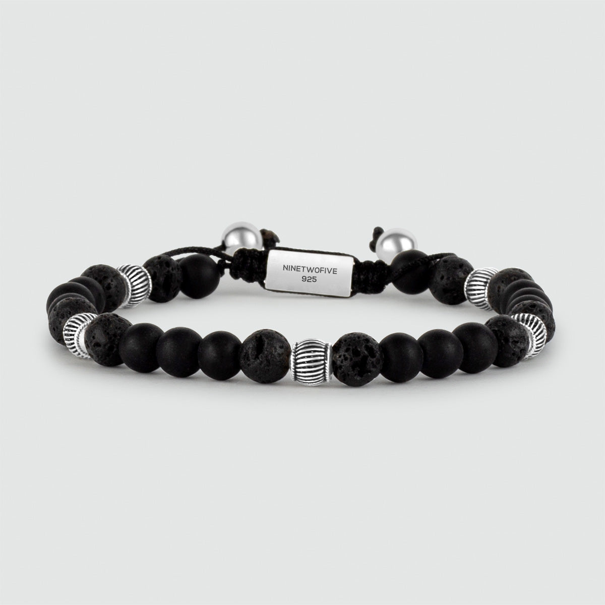 A Kaliq - Adjustable Onyx Black Beaded Bracelet in Silver 6mm with a silver bead.