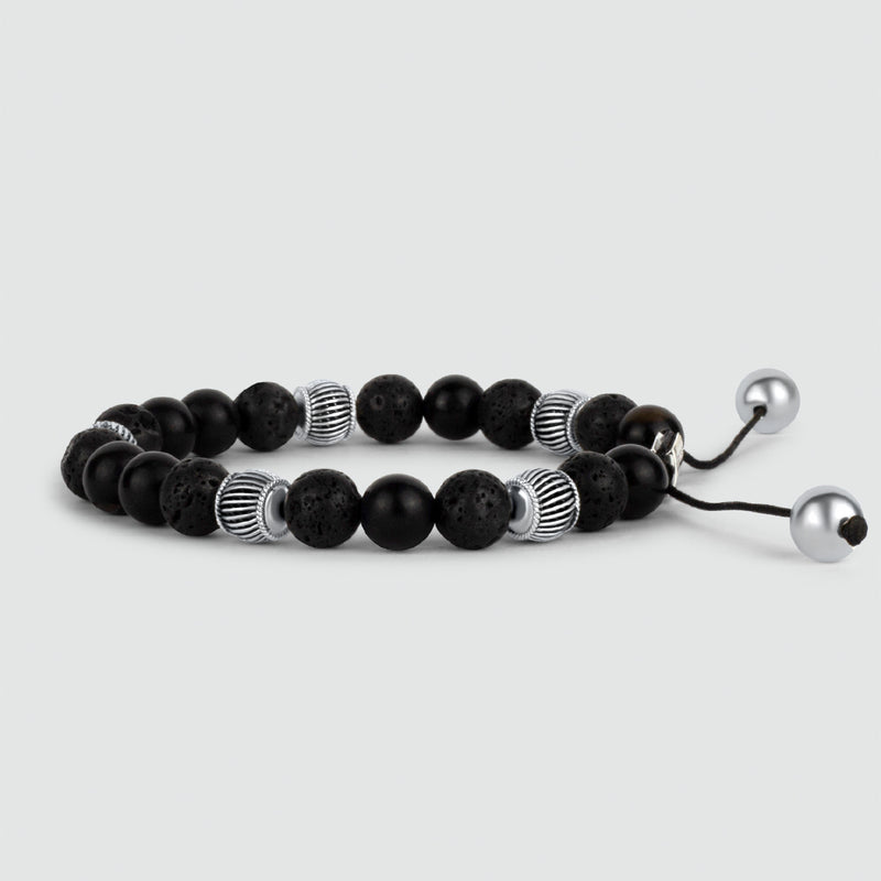 Angle view of Kaliq adjustable beaded bracelet in 925 silver adorned with black onyx beads.