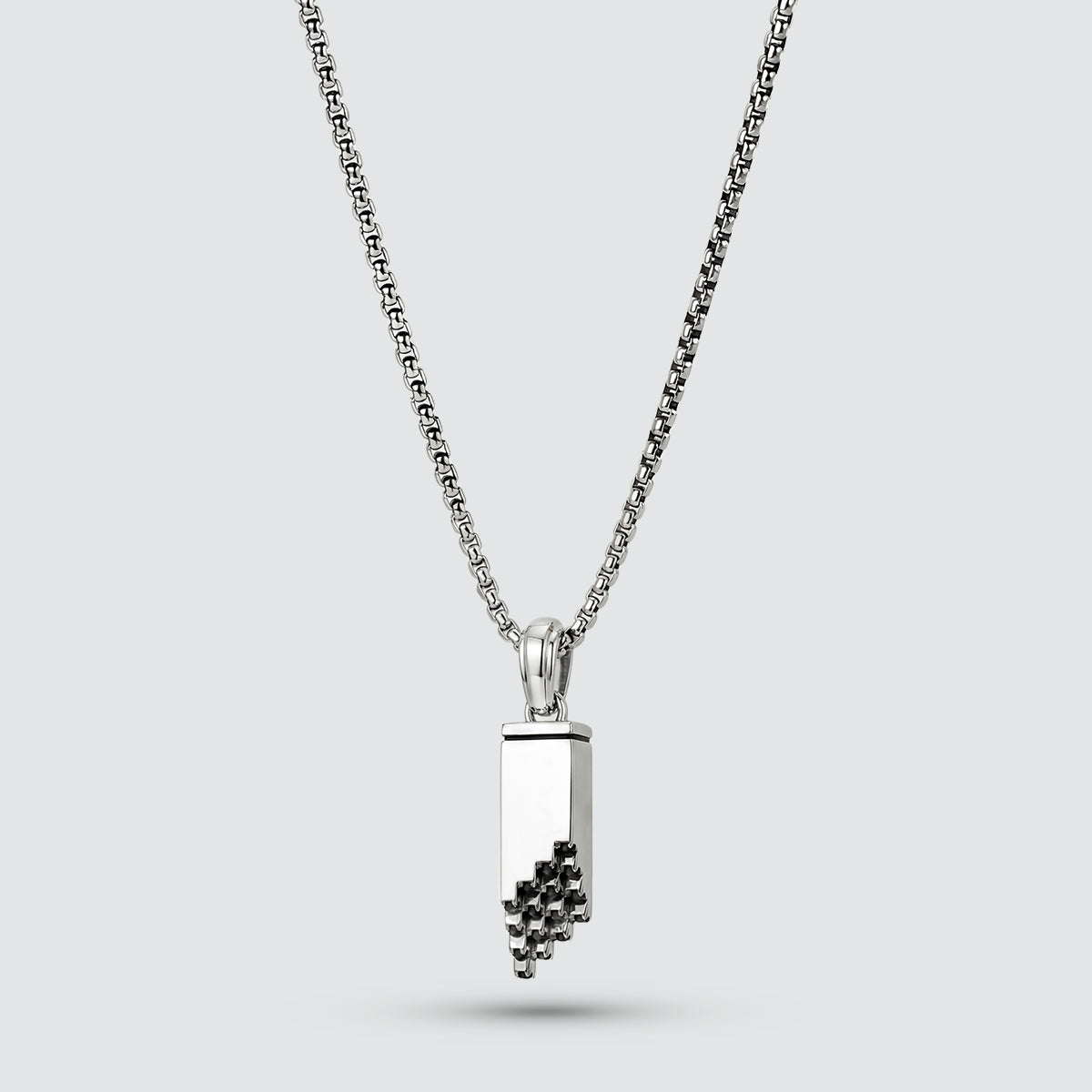 Black diamonds mens pendant with mens chain. Muqarnas front view in polished silver by Ninetwofive.