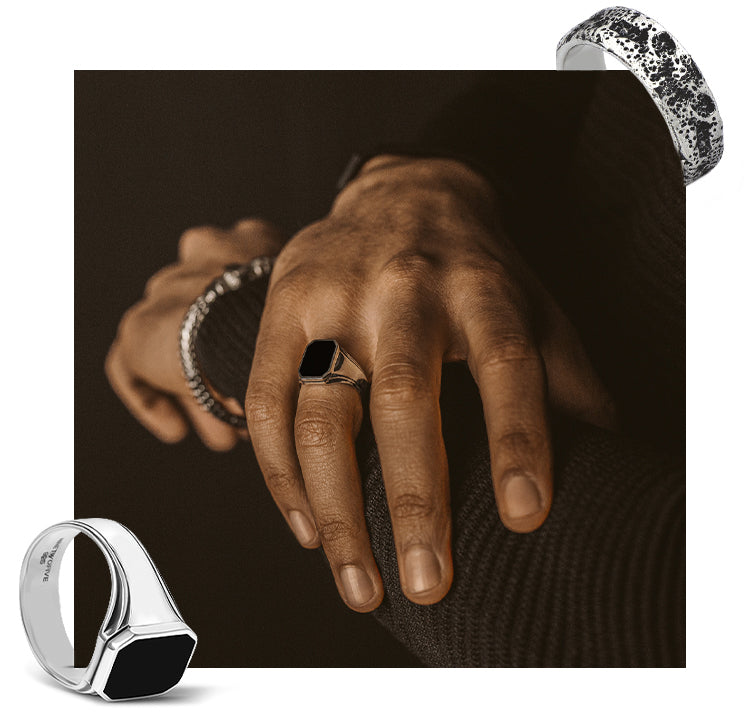 A man wearing 925 silver black onyx mens signet rings and byzantine bracelets from ninetwofive 