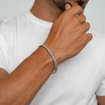 Idris - Braided Silver Bangle Bracelet 8mm, close-up model photo