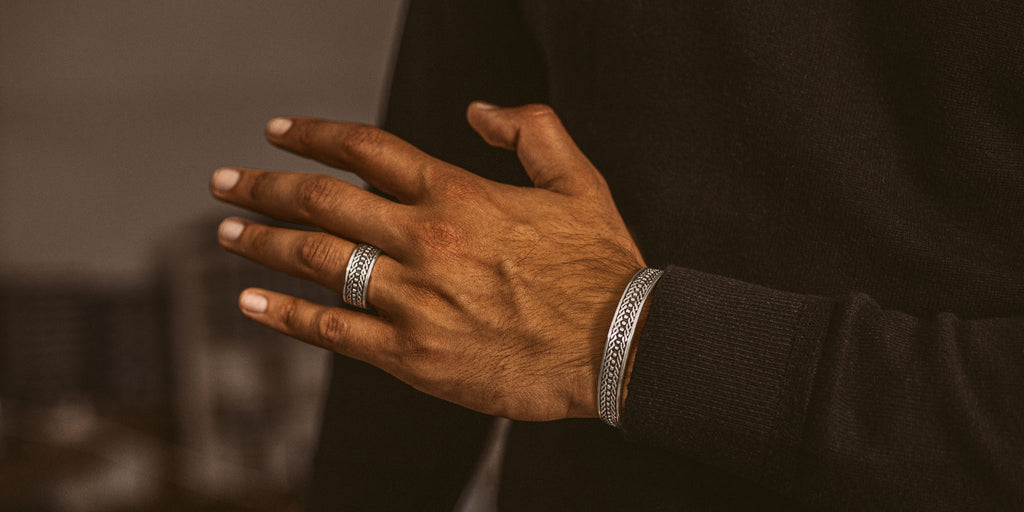 A man wearing a silver ring.