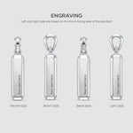 Silver pendant with engraved text on four different sides on a light gray background.