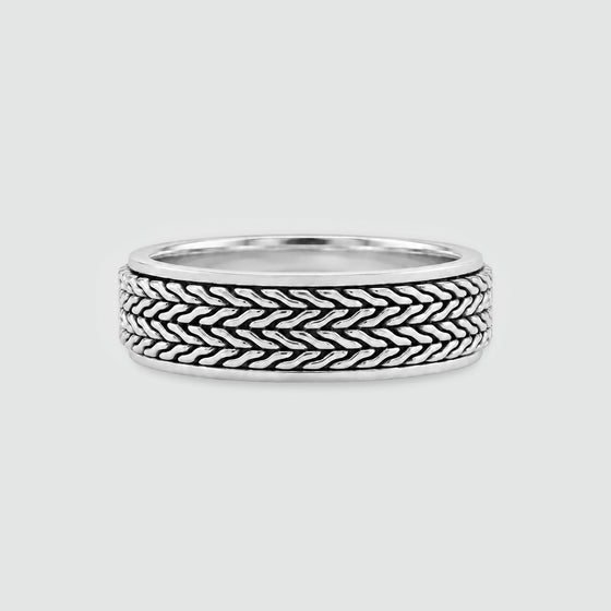 Hani sterling silver spinner ring, front view of the oxidised herringbone outer band