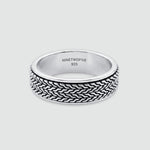 A sterling silver ring with a textured, woven basket-like pattern on the outer band, shown on a light gray background. The inside of the band is engraved with 'NINETWOOFIVE 925'.
