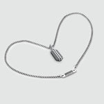 Top view of Berlin architecture-inspired design on Kaliq sterling silver pendant and mens chain by Ninetwofive.