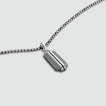 Top view of Kaliq oxidised sterling silver pendant for men. Ninetwofive