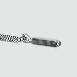 Side view of high polished Kaliq oxidised sterling silver pendant from Ninetwofive