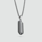 Close-up of Kaliq sterling silver pendant showcasing details inspired by Berlins 50Hertz building. Ninetwofive