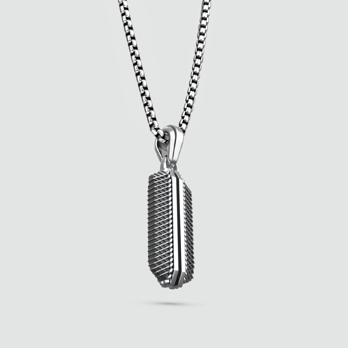 Close-up of Kaliq sterling silver pendant showcasing details inspired by Berlins 50Hertz building. Ninetwofive
