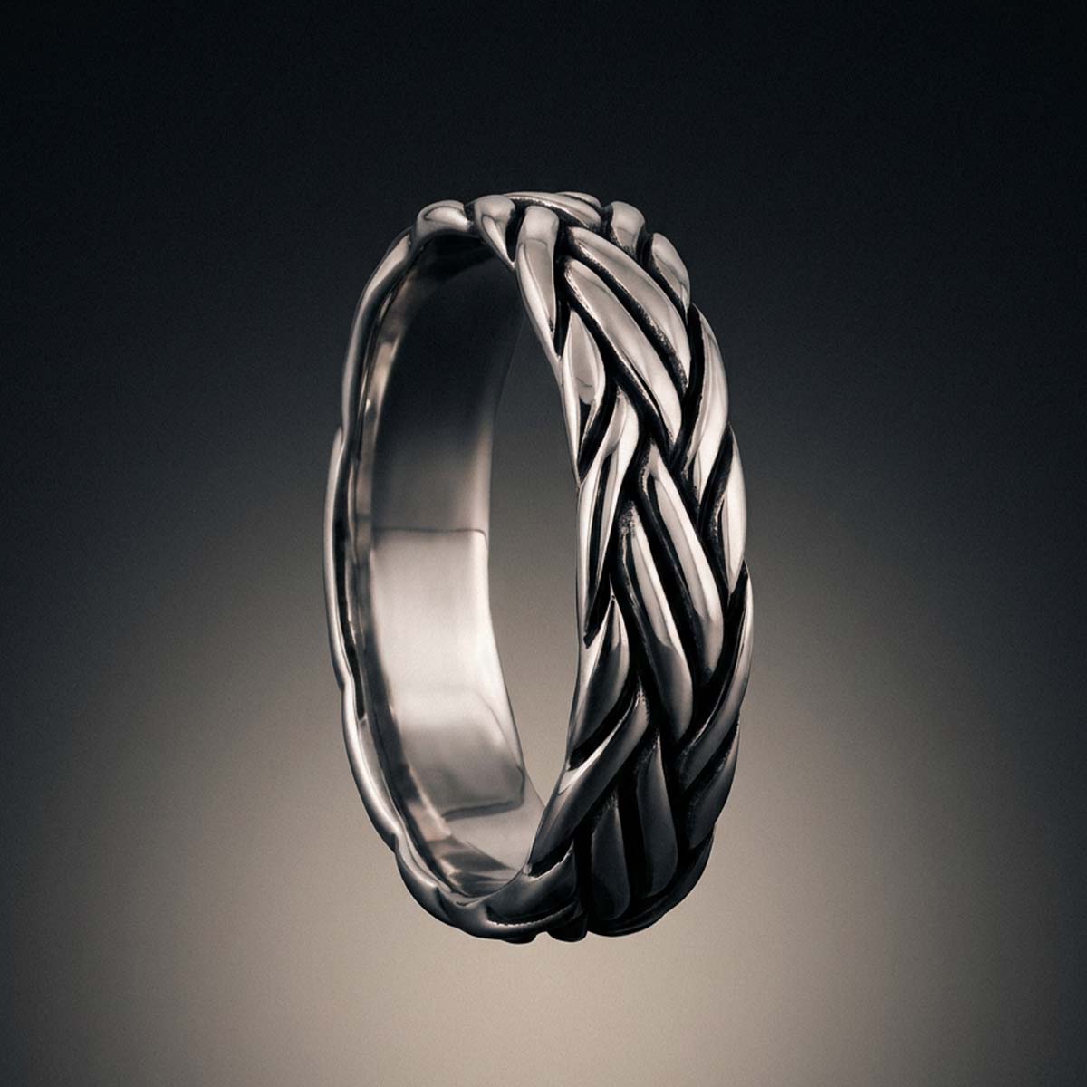 Mood shot of the Latif sterling silver braided ring, inspired by bridge cables