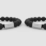 angle view of the lava stone two bracelets for men from Ninetwofive with engraved numbers in front.