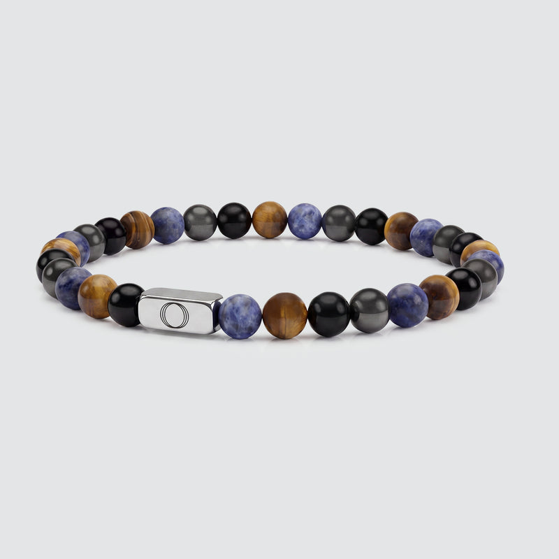 Heren armband met kralen, voorzien van natuurlijke blauwe kantagaatstenen en een kubusvormig detail van roestvrij staal