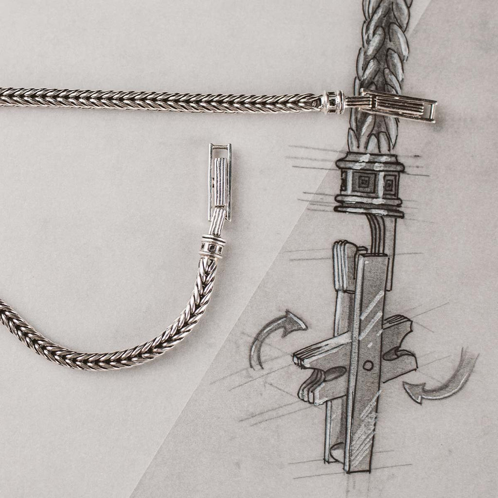 A drawing of a chain with a cross on it.