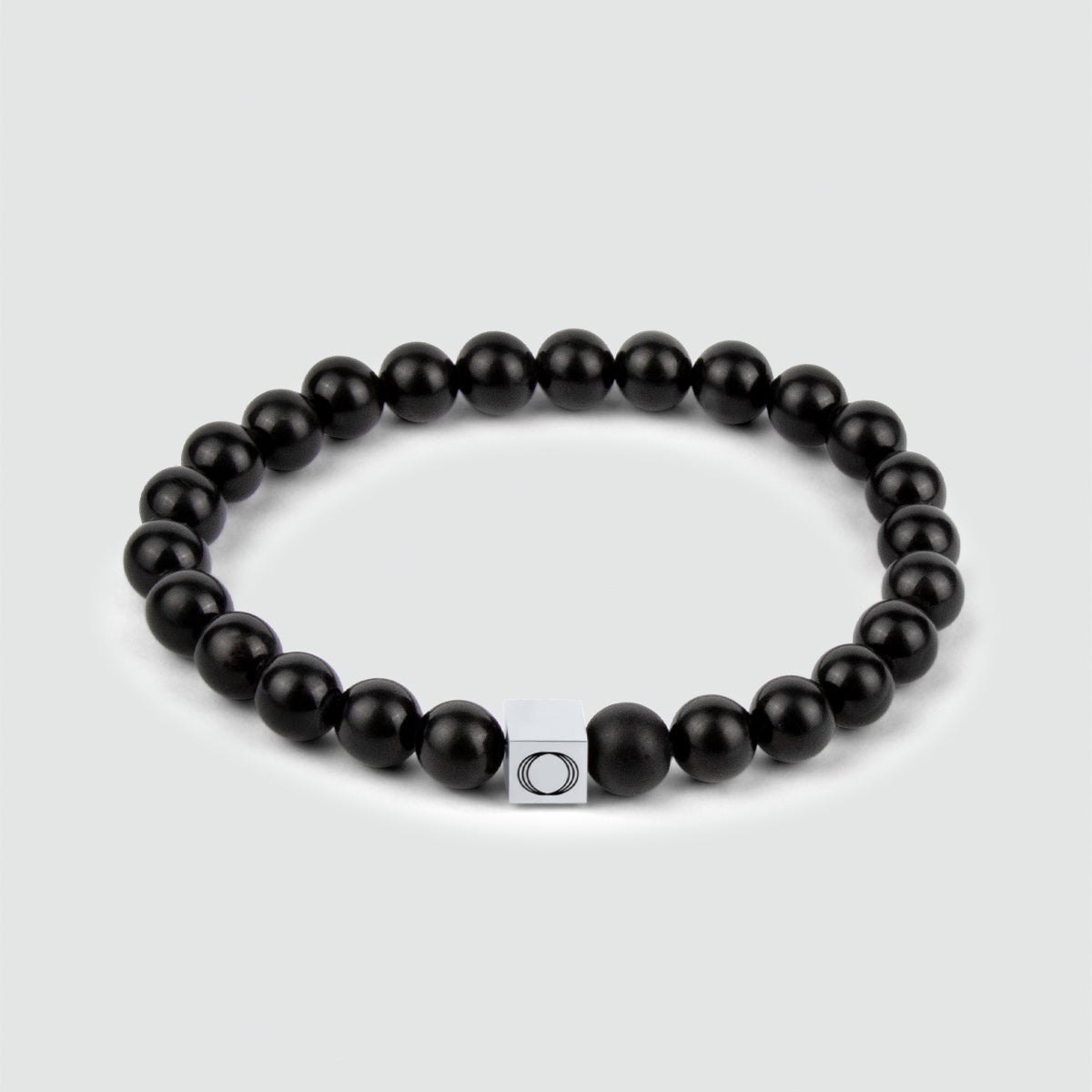 Aswad - Matzwarte Kralen Armband 6mm met elegant gewicht en slanke dikte.