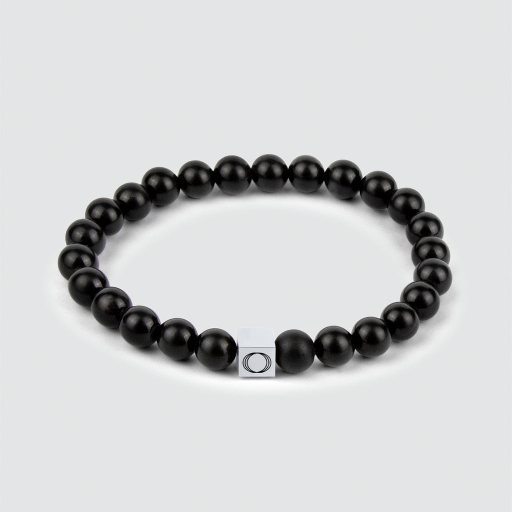 Aswad - Bracelet en perles noir mat 8mm d'une épaisseur de 8mm et composé de pierres d'onyx.