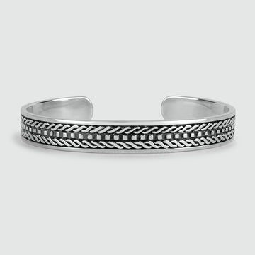 A Fariq - Oxidized Sterling Silver Bangle 10mm with a braided pattern.