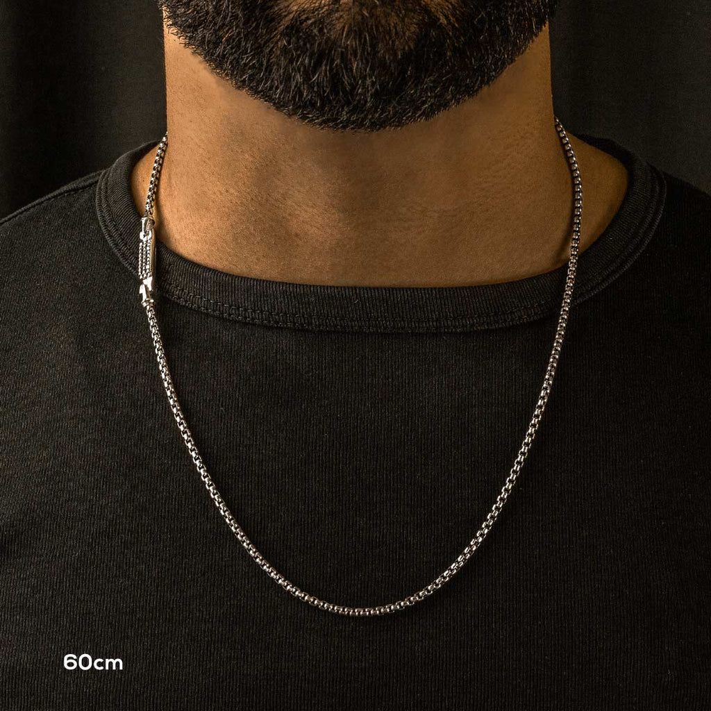 A man with a beard wearing a Kamal - Sterling Silver Box Chain Necklace 3mm.