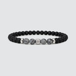 Valentines gift mens stone beaded bracelet from Ninetwofive displayed on a white background. 