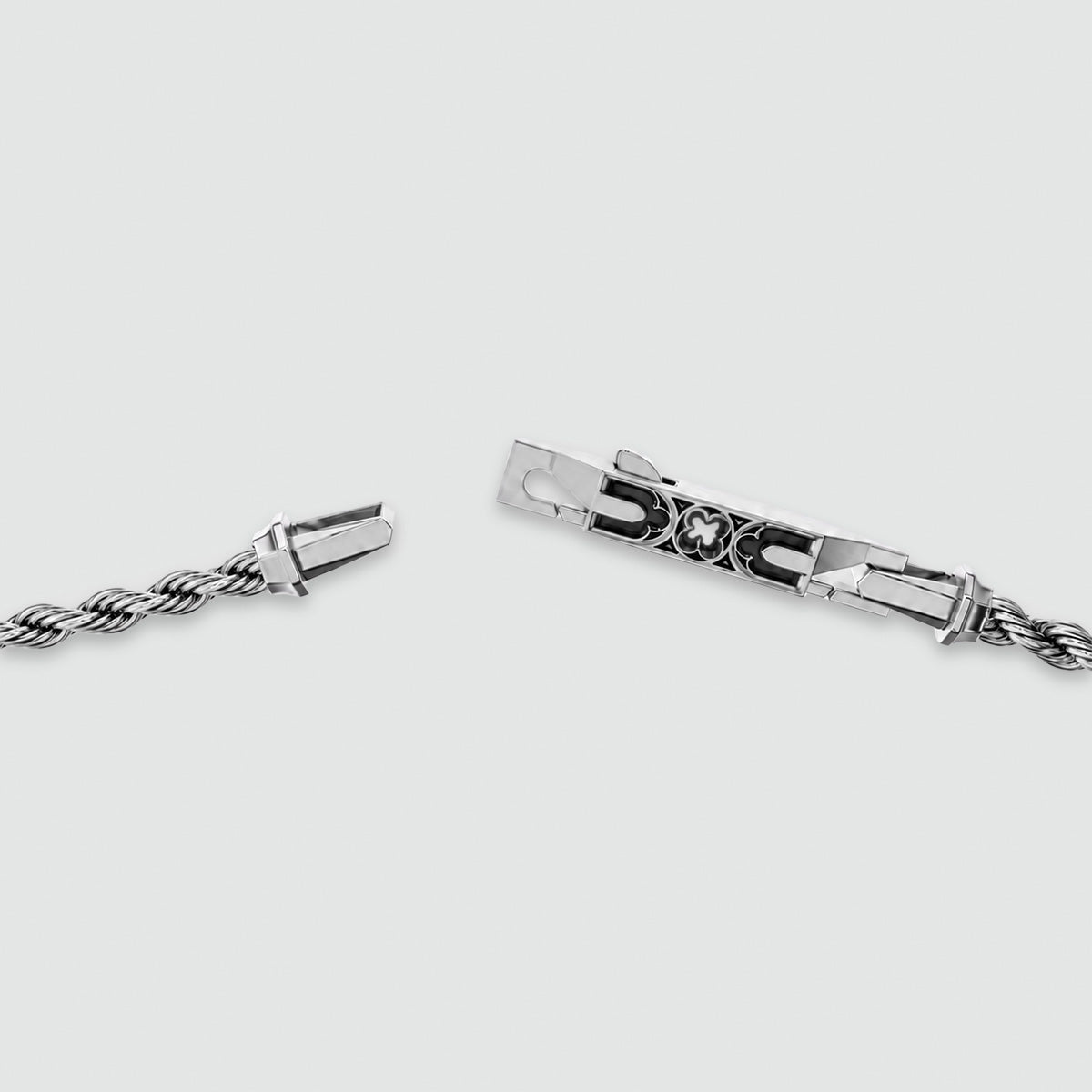 The Munir quatrefoil clasp opened, showing the easy on, easy off fastening