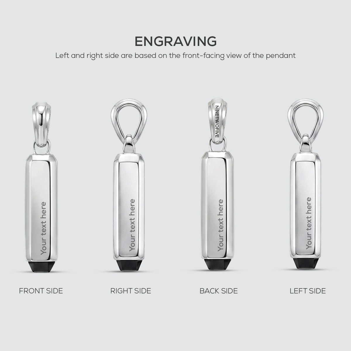 Silver pendant with text engraving on four sides on a light gray background