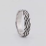 Latif sterling silver braided ring turning, showing the cable-inspired strands