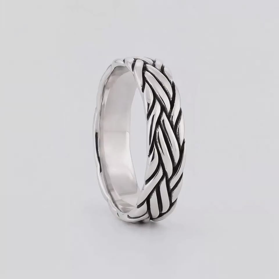 Latif sterling silver braided ring turning, showing the cable-inspired strands