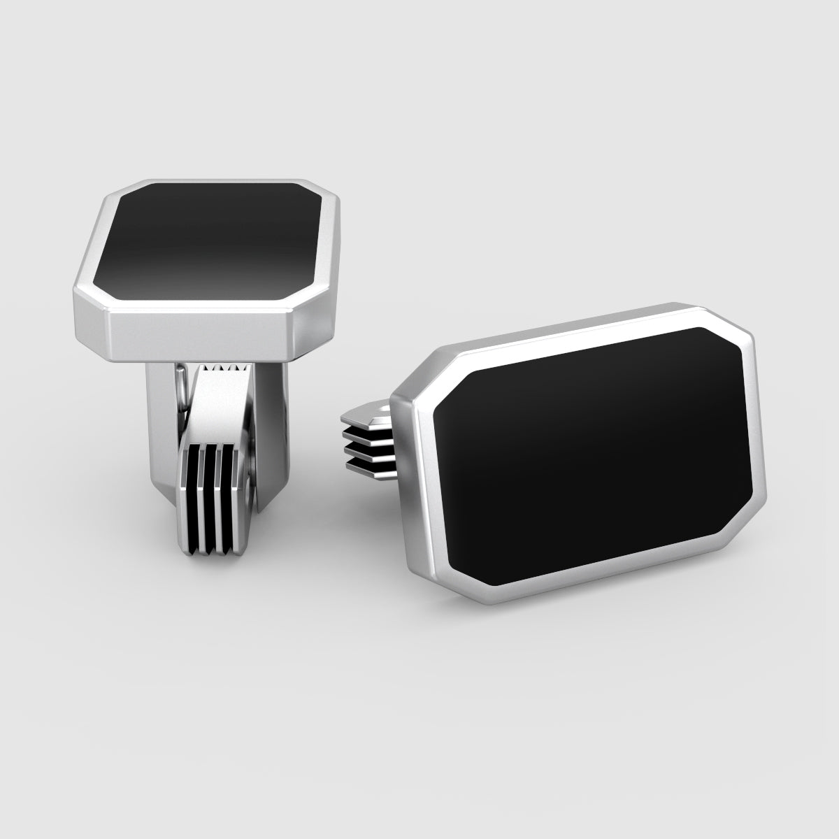 Close-up van Rael Black Onyx manchetknopen voor heren met sluiting en zilveren details van Ninetwofive.