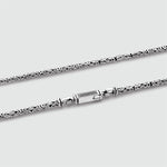 Detailed view of mens Ramsi 925 silver chain clasp in cavetto design from Ninetwofive.