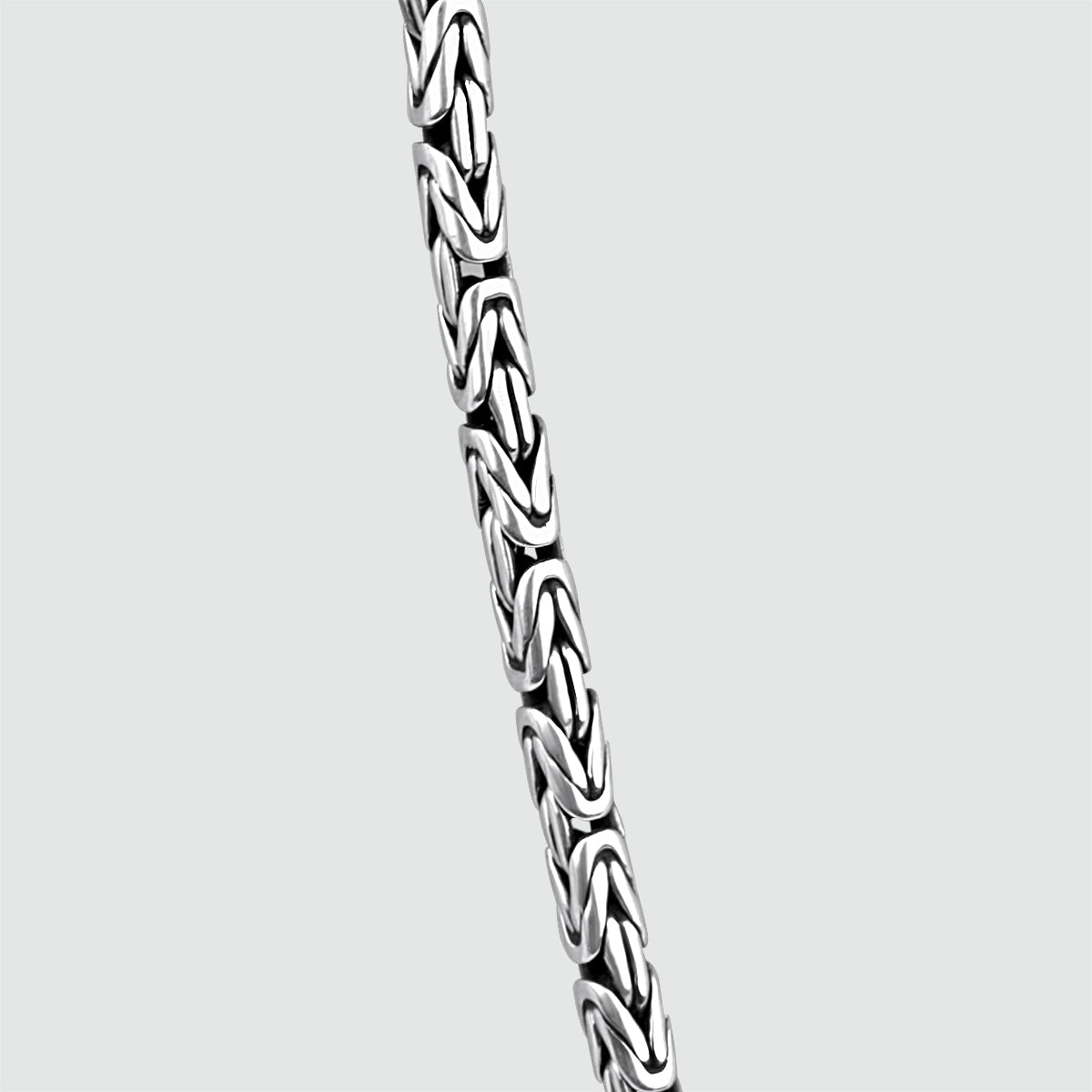 Detailed view of mens Ramsi sterling silver chain in cavetto design from Ninetwofive.