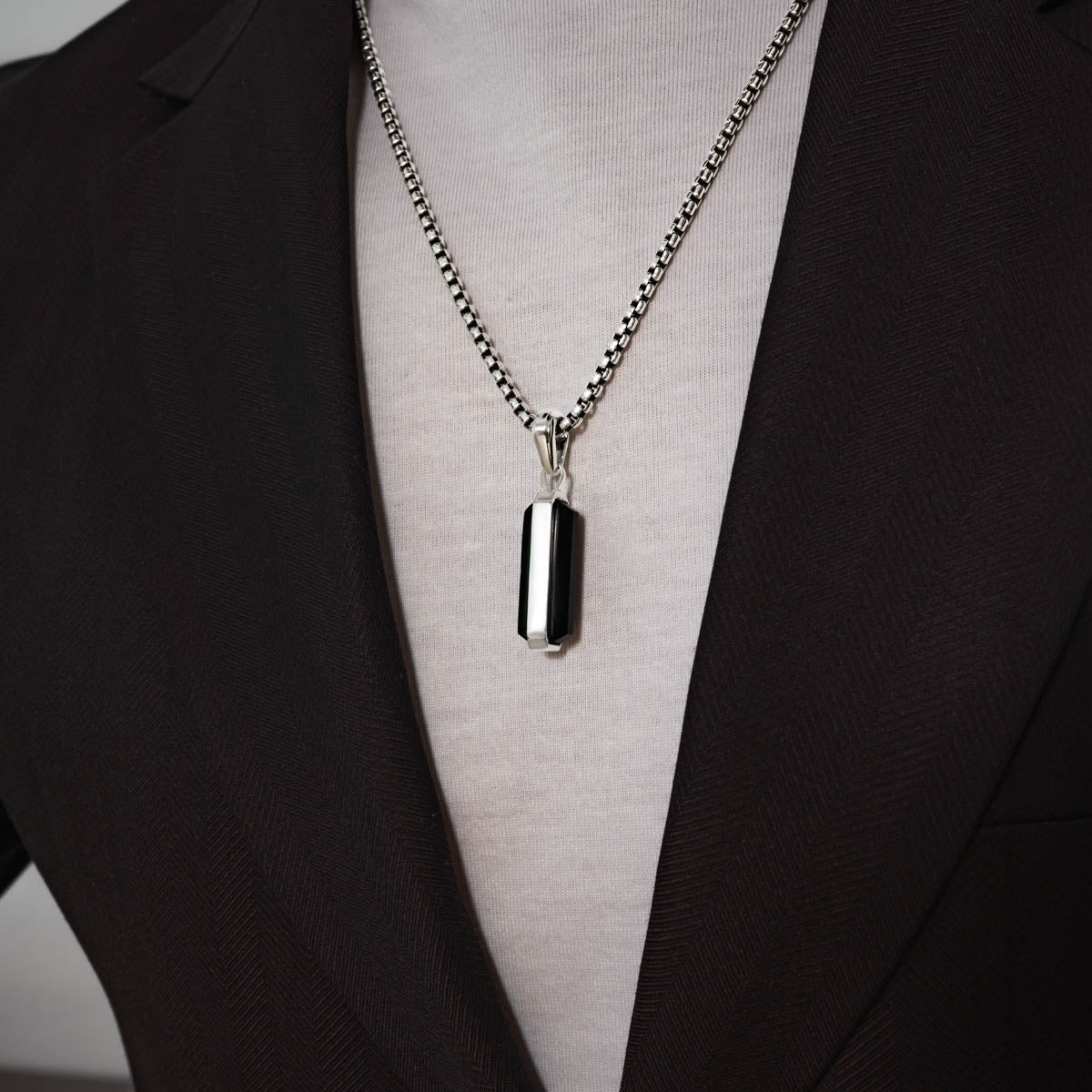 Man wearing samir sterling silver black onyx pendant for men from Ninetwofive.