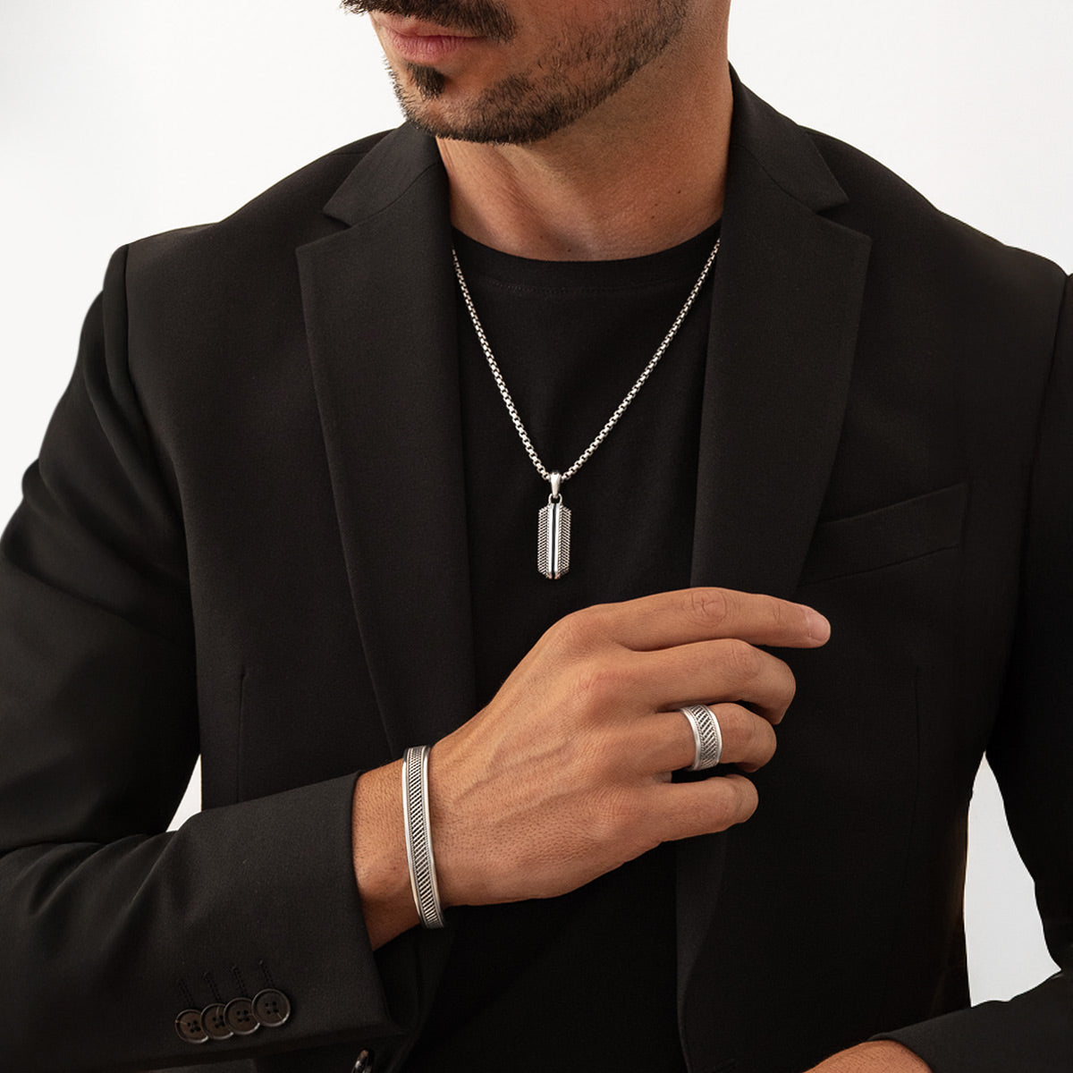 Model wearing Kaliq sterling silver pendant, bracelet and ring inspired by Berlin architecture. Ninetwofive