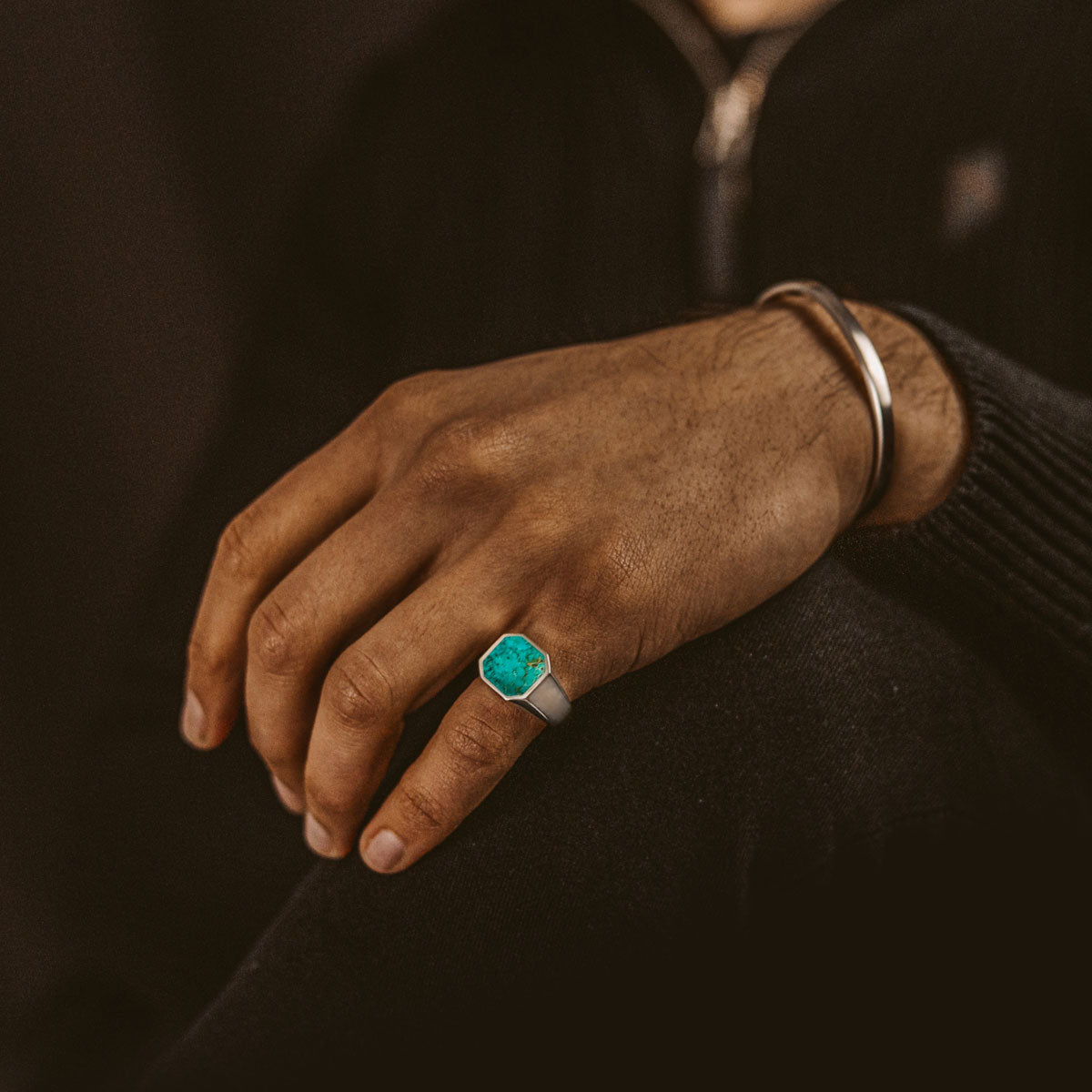 Model wearing blue turquoise silver signet ring on his little finger. Ninetwofive